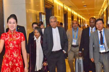 PM Ranil Wickremesinghe and Prof. Maithree Wickremesinghe being welcomed at the Capital International Airport in Beijing last evening. The PM arrived in Beijing to take part in the ‘One Belt, One Road’ summit.