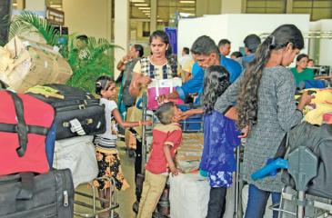 Refugees returning home to Sri Lanka  from India await clearance at the Bandaranaike International Airport.