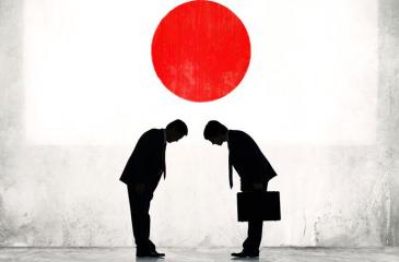 Two businessmen greet each other in Japan