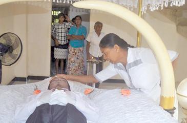 Nandawathie bids farewell to her only son.