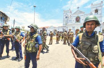 Pic caption Sri Lankan soldiers secure St. Anthony Shrine after an attack in Colombo on Sunday. At least 290 people were killed and over 450 injured in eight blasts across the country. © AP