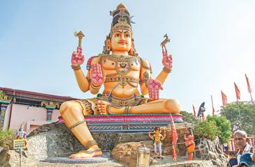 The front view of the magnificent Koneshwaran Temple with a gigantic statue of Lord Shiva 