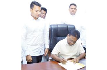 Newly appointed Sports Minister Dallas Alahapperuma assumes duties as former Sri Lanka rugby captain and MP Namal Rajapaksa (left) and MP Shehan Semasinghe (right) grace the occasion  