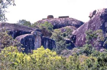 The main ancient dagoba on the summit of the lofty impressive rocky boulder of Kudumbigala forest hermitage in Bagura Lagoon in Panama