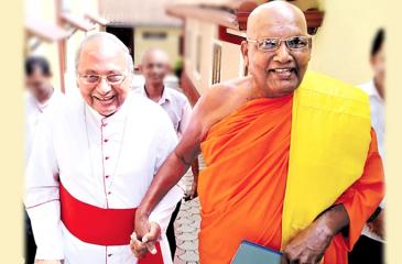 His Eminence Malcolm Cardinal Ranjith given a hand by Ven. Dr. Ittapana Dharmalankara Thera, the Mahanayake of Kotte Sri Kalyani Samagri Dharma Maha Sanga Sabha of Siyam Maha Nikaya