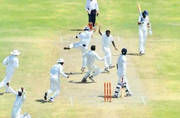 Muralitheran celebrates taking his 800th wicket in a Test match against India in Galle in 2012 before retiring