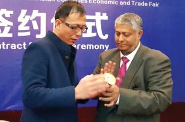 Chairman Interline Gems, Ifham Hanif with a tile manufacturer in China looking to invest in Sri Lanka