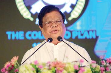 Minister Dr. Bandula Gunawardena addressing the  Colombo Plan anniversary event
