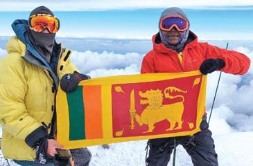 Johann Peiris and fellow  climber poses with Sri Lanka’s flag on top of Mt. Elbrus.