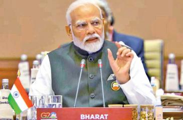 Indian Prime Minister Narendra Modi addressing the G20 Summit,  with “Bharat” country name tag.