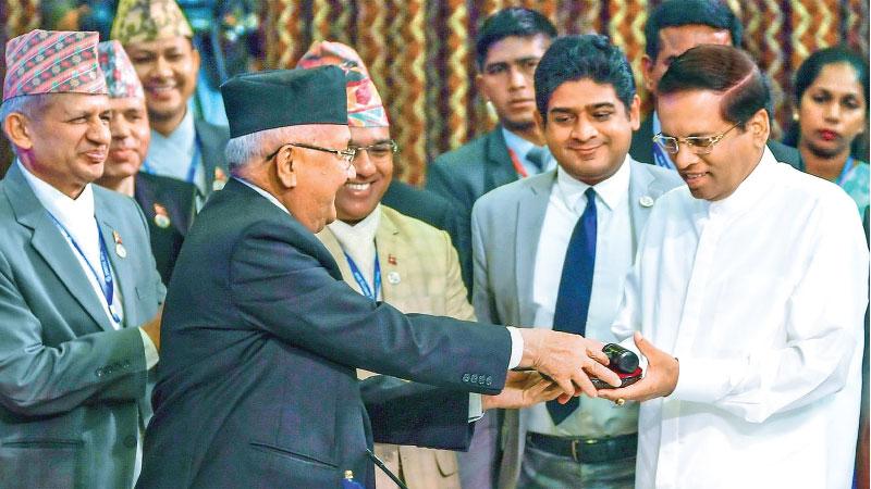 The Chairmanship of the fifth Summit of the Bay of Bengal Initiative for Multi-Sectoral Technical and Economic Cooperation (BIMSTEC) was handed over to President Maithripala Sirisena by Nepali Prime Minister Khadga Prasad Sharma Oli during the conclusion of the fourth BIMSTEC Summit in Kathmandu on Friday. Pic: Sudath Silva