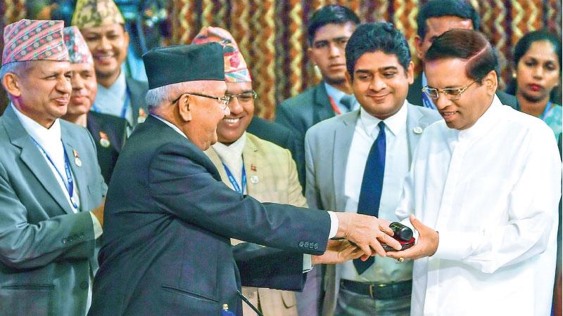 The Chairmanship of the fifth Summit of the Bay of Bengal Initiative for Multi-Sectoral Technical and Economic Cooperation (BIMSTEC) was handed over to President Maithripala Sirisena by Nepali Prime Minister Khadga Prasad Sharma Oli during the conclusion of the fourth BIMSTEC Summit in Kathmandu on Friday.                                                             Pic: Sudath Silva