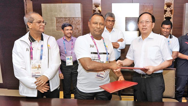 Suresh Subramaniam, president of the NOC of Sri Lanka, and his Chinese counterpart Gou Zhongwen  the Chinese Sports Minister signed a historic MOU which will help facilitate the development of local athletes to the next level. (Pic by Thusith Wijedhoru NOC media)     