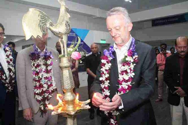 Country Director British Council Keith Davies OBE lights the oil lamp.