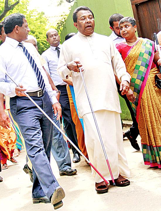 Carrying a white cane and walking at the head of a short procession of visually handicapped people, Social Empowerment and Welfare Minister S. B. Dissanayake participated in the Government’s celebration of International White Cane Day (October 15th) at the Apé Gama cultural complex in Pelawatte, near Parliament. (Photo: Dushmantha Mayadunne )