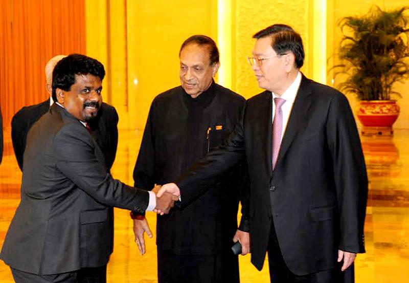 The gleam in JVP leader Anura Kumara Dissanayaka’s eye as he is greeted by his host, Chairman of the Standing Committee of China’s Parliament, the National People’s Congress, Dejiang Zhang, may reflect a sense of triumph that, at last, he, an ideological progeny of Maoism in Sri Lanka, is hosted in the original home of the ‘revolutionary’ ideology that once inspired many a social movement worldwide. Dissanayaka was part of the Parliamentary delegation that visited China last week led by Speaker Karu Jayasur
