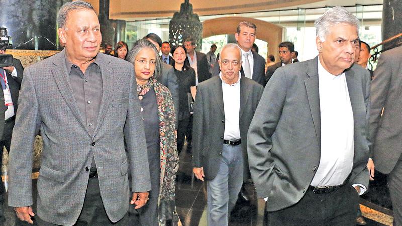 Prime Minister Ranil Wickremesinghe and National Policies and International Trade Minister Malik Samarawickrama received by Sri Lanka Ambassador in China, Karunasena Koddithuwakku on arrival in Hong Kong.