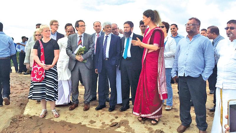 The UNOPS Program Manager outlines details regarding the landfill to the EU delegation and officials.     