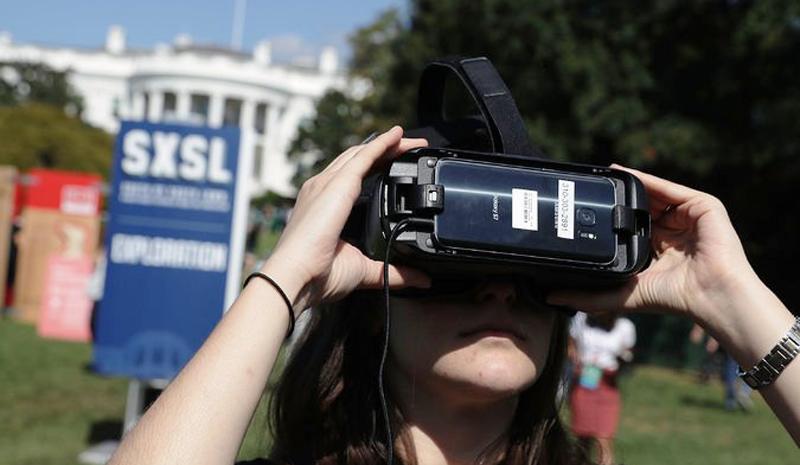 A woman experiencing virtual reality during the South by South Lawn festival at the White House in October 2016. President Obama, who rode many of these digital tools to the presidency, was accommodating of their rise.                                       Photo:  Alex Wong/Getty Images 