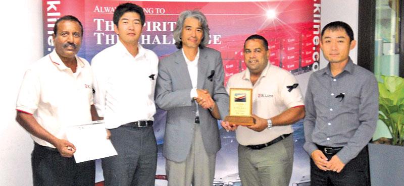 General Manager Tressel G. Silva receives the Excellence Award and the Certificate from General Manager, Car Carrier Department, Thailand, Masahiko Taki.