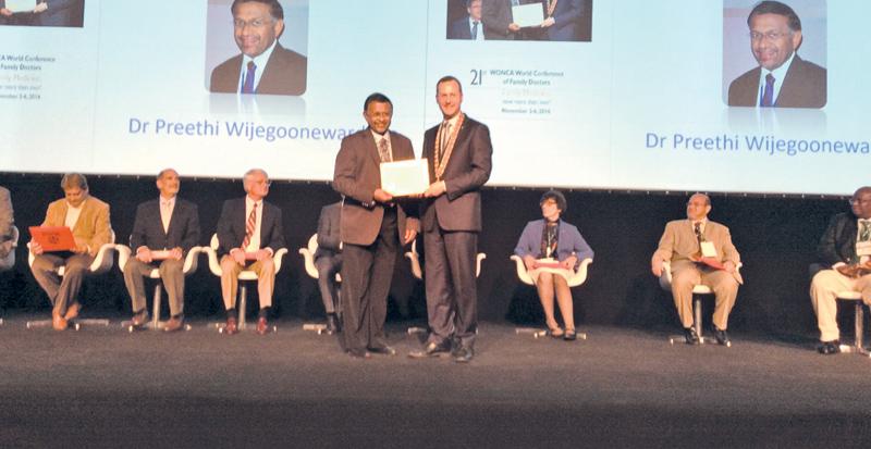 World President of WONCA, Prof. Michael Kidd awarding the Fellowship to Dr. Preethi Wijegoonewardene.