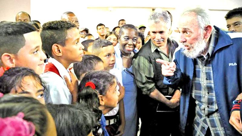 Havana: This photo taken on April 12, 2013 and published in the Cuban official website www.cubadebate.cu shows former President Fidel Castro talking to children during the inauguration of a school in Havana. Cuban revolutionary icon Fidel Castro died on Saturday, his brother announced on national television. – AFP