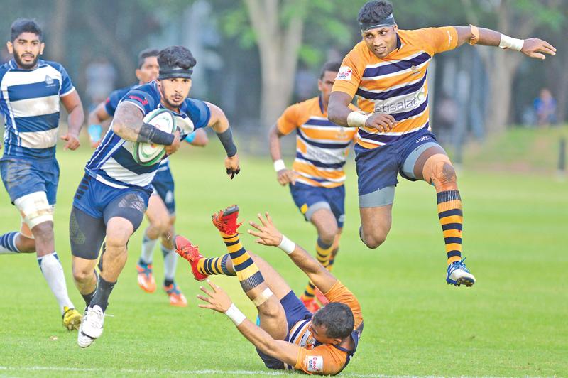 Navy SC’s hero Lee Keegal on his way to scoring the match-winning try in their Dialog ‘A’ division rugby match against Army SC . (Pic by Thilak Perera)    