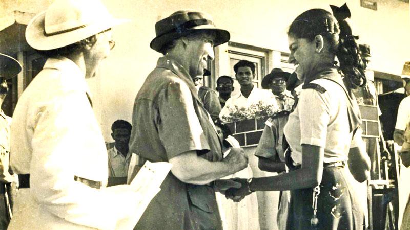 Lady Baden Powell meets Marlyn Dissanayake at a Scout and Girl Guide Rally in 1958. Looking on is Miss Edna Alwis – 1st Sri Lankan Chief  Commissioner.  