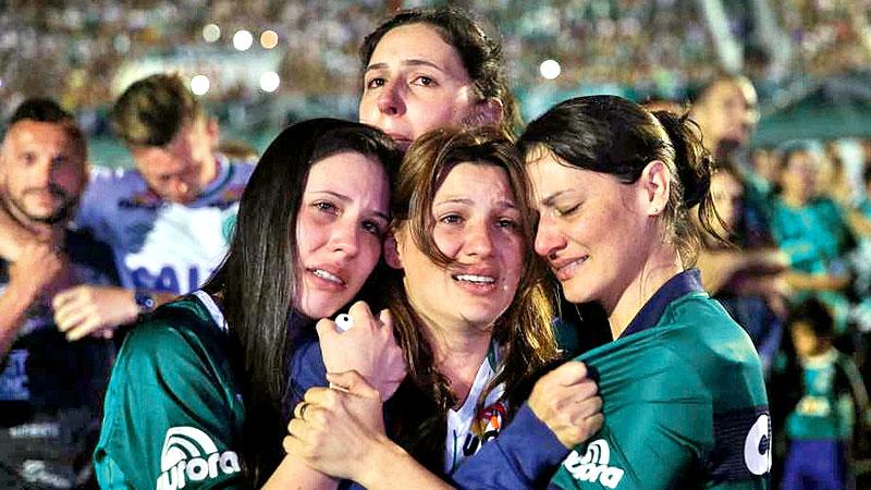Relatives and supporters of Chapecoense soccer players, mourning the dead. 