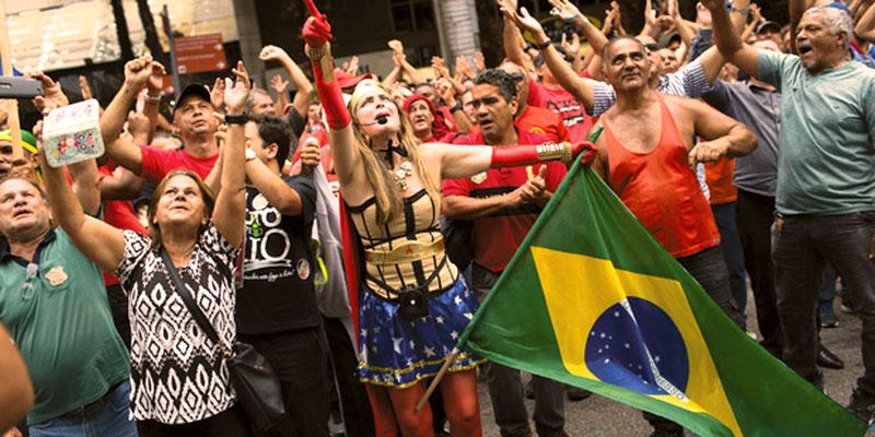 Demonstrators shout outside the state of Rio de Janeiro’s legislative assembly building where lawmakers are discussing austerity measures in Rio de Janeiro, Brazil.     