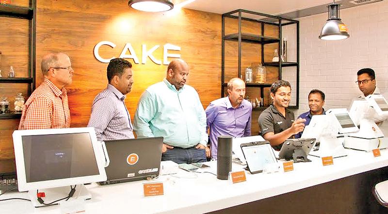 A member of the Cake Labs team demonstrates new innovations in the pipeline to the visiting Sysco team