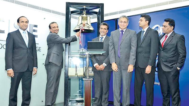 Asiri Group Chairman and Managing Director Ashok Pathirage rings the opening bell at the CSE.