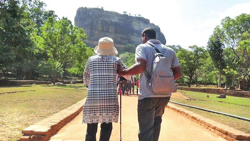 An elderly foreign tourist being ‘escorted’