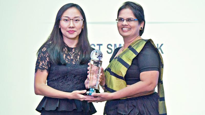 Commercial Bank Deputy General Manager, Personal Banking, Sandra Walgama (right) receives the IFM Best SME Bank award.