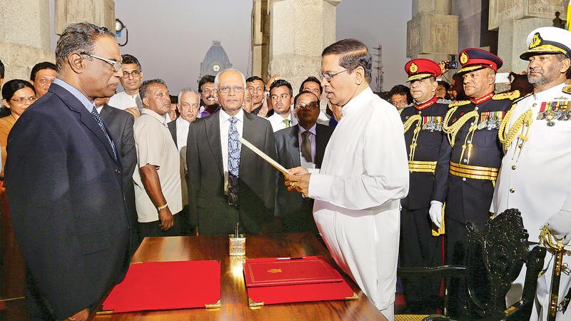 Taking the oath as the President before Chief Justice K. Sripavan