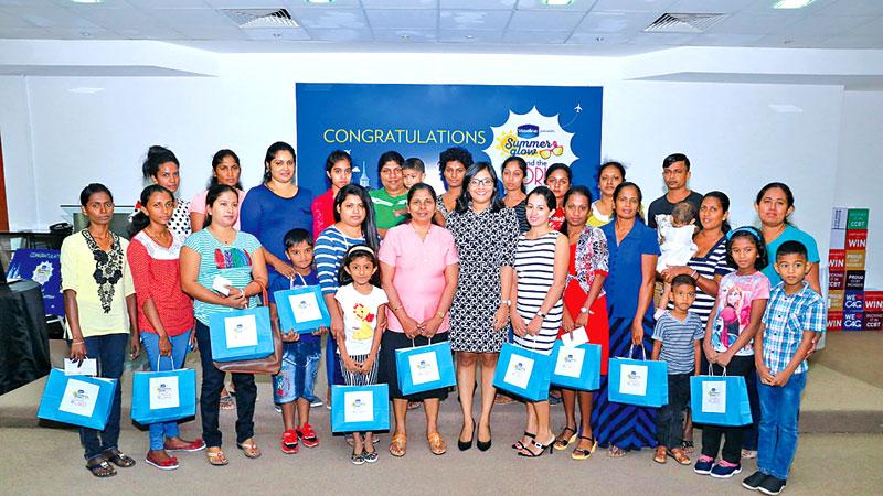  The 24 winners with their families and Vidhushi Rambukwella at the awards ceremony   