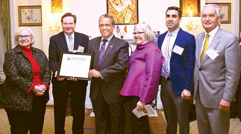 Ambassador Kariyawasam is presented with a certificate of appreciation in recognition of his commitment to global education and international affairs, by the Chair of the Board of Directors of the WAC-DC,Dr. Doug Shaw.
