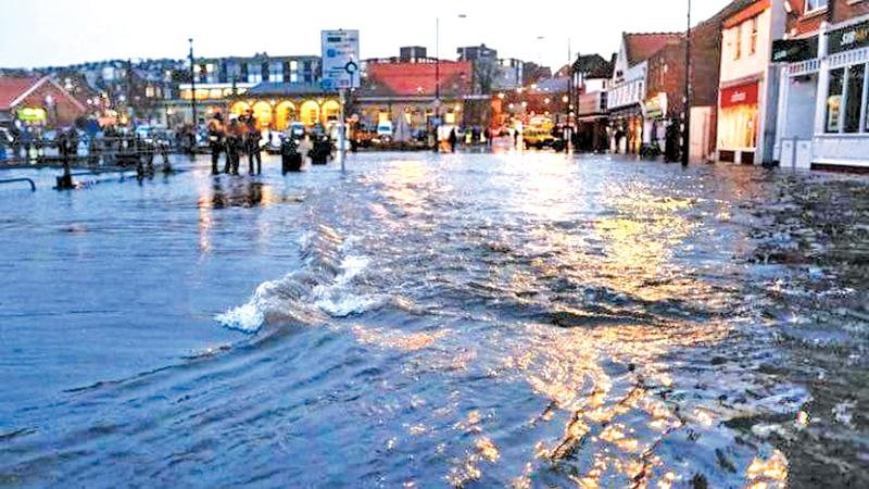 Streets were closed in Whitby after a tidal surge caused flooding on Friday evening Credit: Getty Images