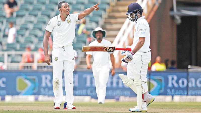 South African fast bowler Kagiso Rabada gestures as he celebrates bowling   out Sri Lanka opener Dimuth Karunaratne for 50 on the third day of the   third and final Test at Wanderers Stadium, Johannesburg on Saturday. AFP    