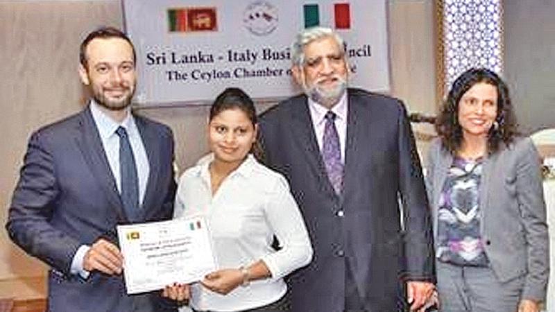 Imalka Maduwanthi of the third batch of the Italian Language Course receives her certificate from Dr. Giandomenico Milano.  