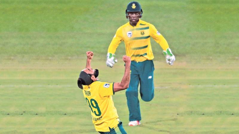 South African Imran Tahir (left) celebrates during the first T20 match between against Sri Lanka on January 20 at Supersport park in Centurion, South Africa. - AFP