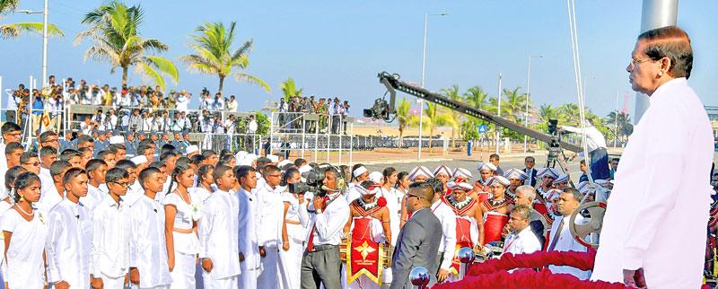 President Maithripala Sirisena stands to attention while the students recite Jayamangala Gatha during the 69th Independence Anniversary celebrations at the Galle Face Green.         (Pic Sudath Malaweera)