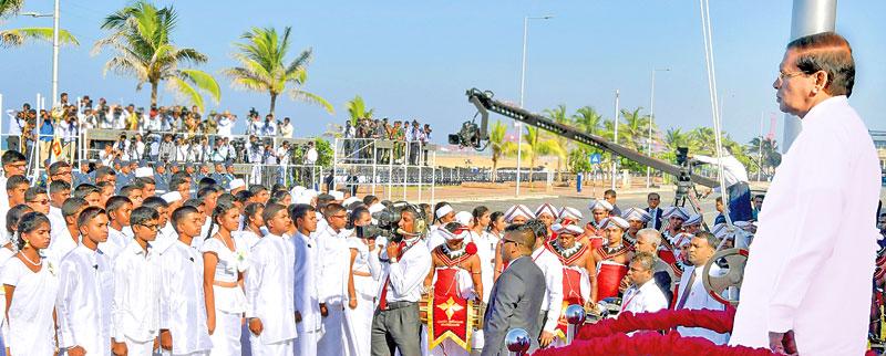 President Maithripala Sirisena stands to attention while the students recite Jayamangala Gatha during the 69th Independence Anniversary celebrations at the Galle Face Green. (Pic Sudath Malaweera)