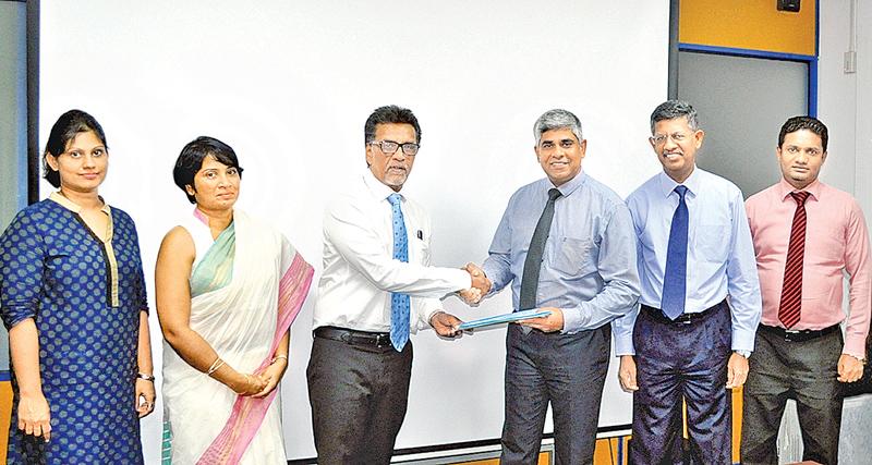 From left: Group Manager Legal, Asiri Group of Hospitals, Nadeeka Wimalathunga, Director Operations, Asiri Group of Hospitals, Dr. Samanthi de Silva, CEO, Asiri Group of Hospitals, Dr. Manjula Karunarathne, COO, National Insurance Trust Fund, Sanath C. de Silva, Chairman, National Insurance Trust Fund, Manjula de Silva and Asst Manager, Agrahara, Anura Samarakoon at the signing of the MoU.   