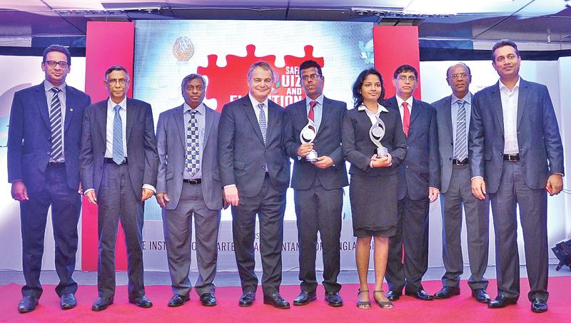 Ravindi Sandini and Hakeem Halwan with their awards. President of the International Accounting Standards Board (IASB), Hans Hoogervorst, President of CA Sri Lanka, Lasantha Wickremasinghe and Vice President Jagath Perera look on.