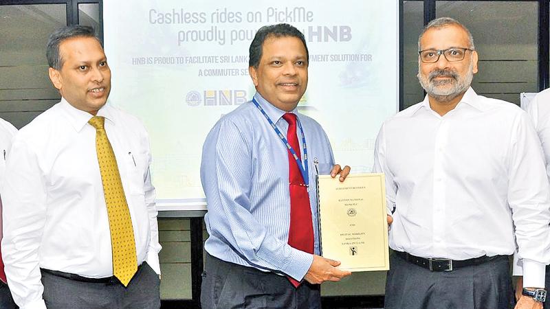 HNB and PickMe officials at the signing of the agreement.   PICTURE BY THUSHARA FERNANDO.  