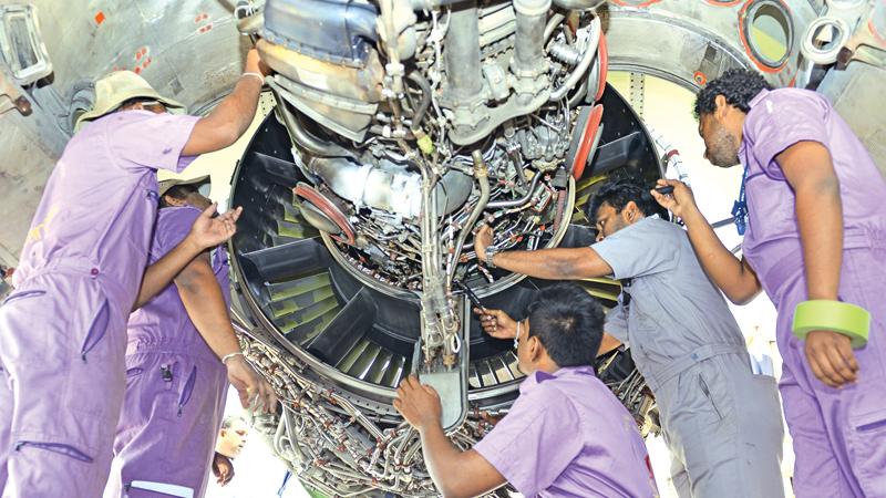 Aircraft technicians at the BIA hanger. PICTURE BY SAMANTHA WEERASIRI.