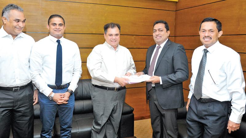 From left: Indika de Soysa, Chathura Jayawardena - General Manager - IT – Abans PLC, Behman Pestonjee - Managing Director – Abans PLC, Akila Viraj Kariyawasam - Hon Minister of Education and Hemantha Premathilake - Additional Secretary – Ministry of Education