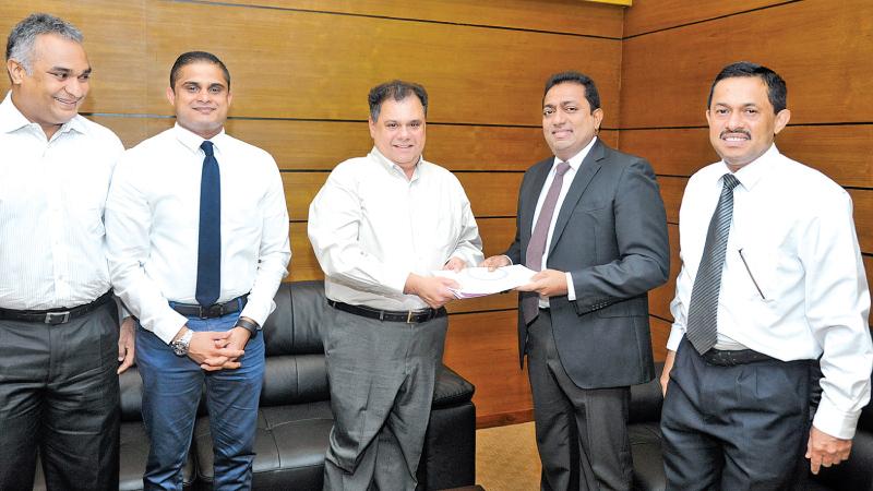 From left: Indika de Soysa, Chathura Jayawardena -  General Manager  - IT – Abans PLC, Behman Pestonjee -  Managing Director – Abans PLC, Akila Viraj Kariyawasam -  Hon Minister of Education and Hemantha Premathilake  - Additional Secretary – Ministry of Education