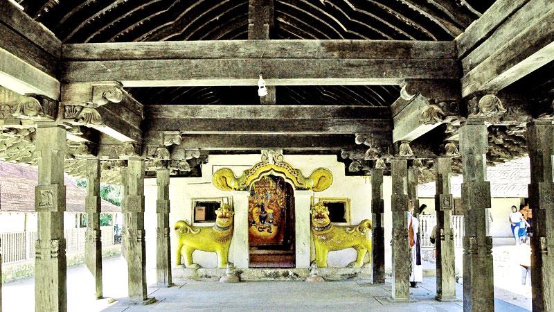 The interior of the Digge (Dancing Hall) of the shrine adorned with elegant designs of wood carvers of centuries ago of Embekke Devale